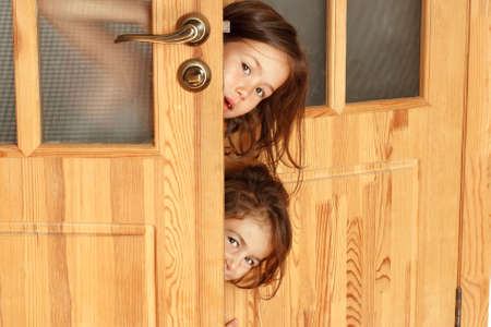 Children curiously look in the morning in the parents roomの写真素材