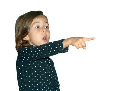 Little girl emotionally pointing at something interestingの写真素材