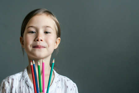 An assiduous student of the art school with colored pencils in handの写真素材