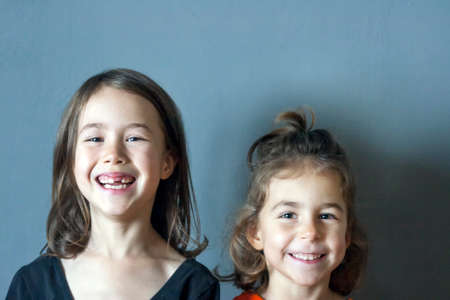 Two cheerful girl athletes smile after a workoutの写真素材