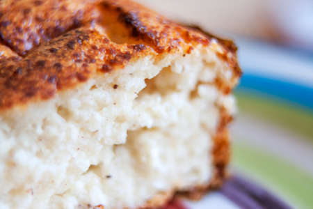 A slice of delicious juicy curd dessert with a ruddy crust