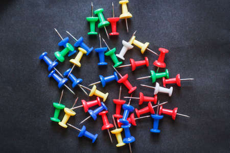 Multicolored Stationery paper clips on a black backgroundの写真素材