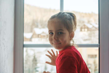 Little girl joyfully meets father from workの写真素材