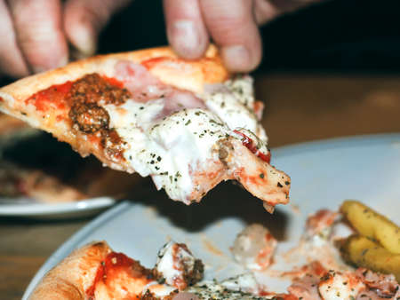 Juicy Italian pizza with spicy jalapeno pepperの写真素材