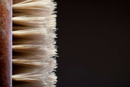 Toothbrush with natural bristles close-up on a gray backgroundの写真素材