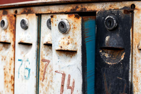 Old rusty mailboxes, like enthusiastic faces waiting for lettersの写真素材