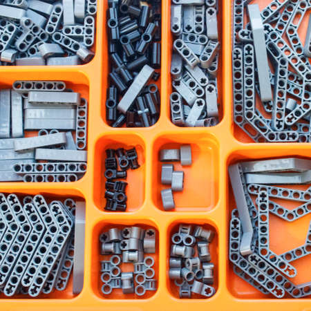 Plastic parts for children's designer in the orange organizer