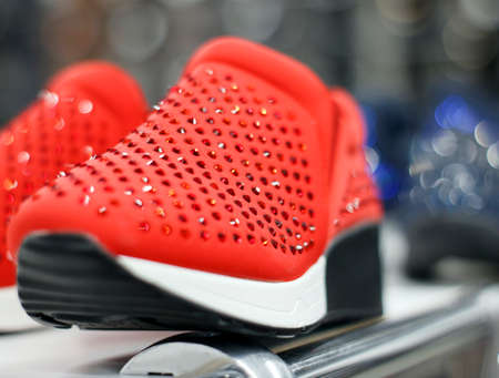 Sneakers with rhinestones on the shoe store shelfの写真素材