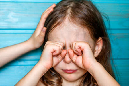 The girl calms her crying friend. Children's friendship, supportの写真素材