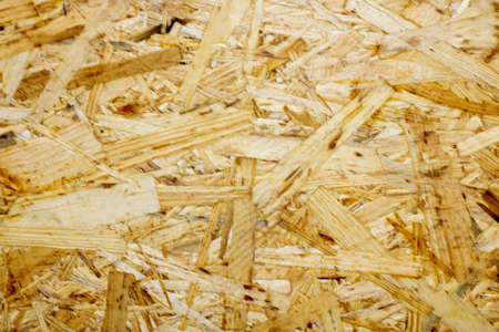 texture of a wooden osb panel of pressed sawdust