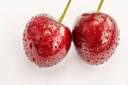 Juicy ripe sweet cherry on white background
