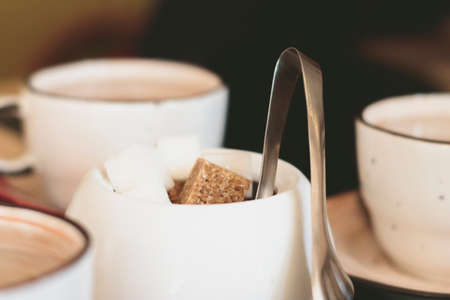 Tea composition in warm brown tinted. Cane sugar, cupsの写真素材