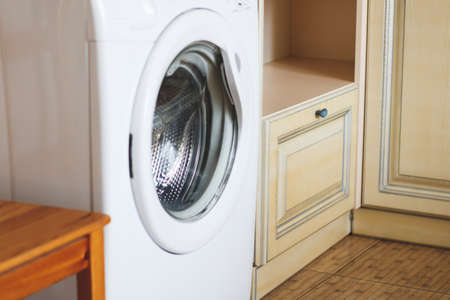 Home washing machine in the kitchenの写真素材