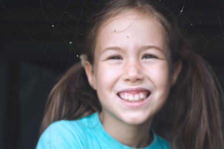 Children spend vacation in the village and playing in wooden houseの写真素材