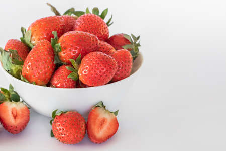 White plate with ripe fresh strawberries