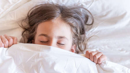 Portrait of a beautiful smiling girl waking up early in the morning. Banner template