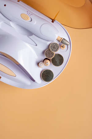 Set for home manicure with various nozzles on a beige background.の写真素材