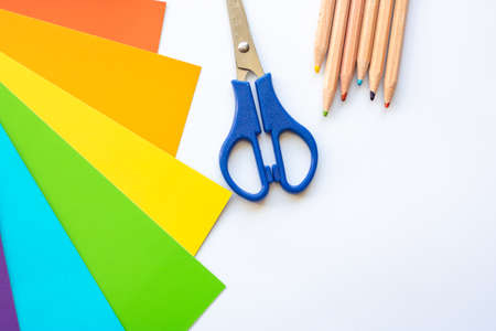 Set for children's craft diy from colored cardboard, paper, scissors and pencils. Template for banner with space for textの写真素材