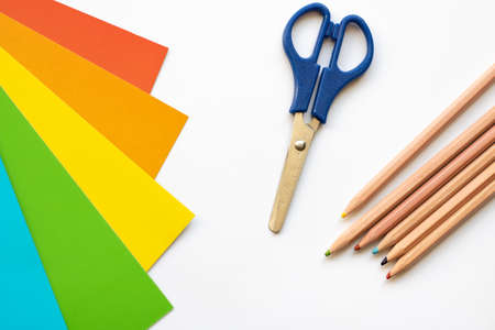 Set for children's craft diy from colored cardboard, paper, scissors and pencils. Template for banner with space for textの写真素材