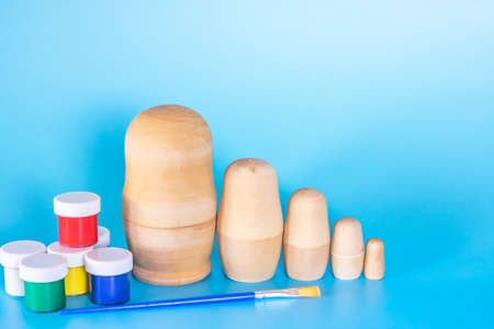 Wooden birch blanks of Russian nesting dolls for coloring. Folk art. Children's craftsの写真素材