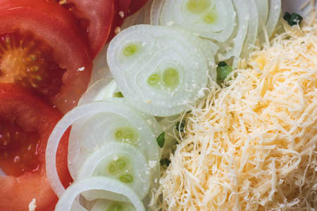 Ingredients for homemade vegetarian pizza on a plate.
