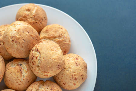 Fresh homemade cakes. Lush curd buns on a white plateの写真素材