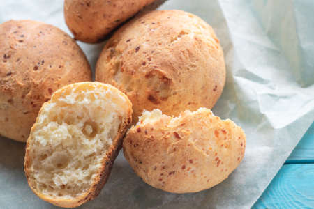 Fresh homemade cakes. Sweet rolls with a golden brown crust on baking paperの写真素材