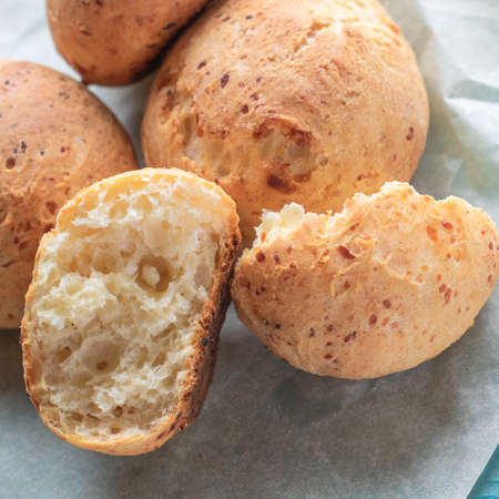 Fresh homemade cakes. Sweet rolls with a golden brown crust on baking paperの写真素材