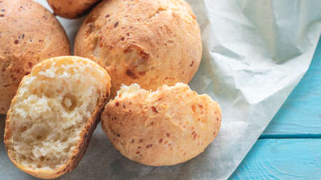 Fresh homemade cakes. Sweet rolls with a golden brown crust on baking paperの写真素材