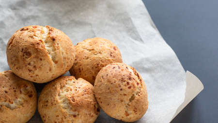 Fresh homemade cakes. Sweet rolls with a golden brown crust on baking paperの写真素材