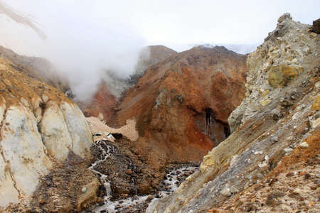 Mutnovsky volcano in Russia in Kamchatka. Mountain top. Active sports and recreation for tourists. Climbing the crater.の写真素材