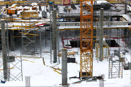 Orange construction crane close-up. Construction of new housing. Buying an apartment in a...