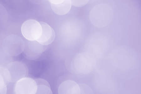 Abstract purple, violet bokeh background. Defocused pattern for advertising, newspaper, magazine design. Universal. Snow, backdrop, sea, glow, gradient.の写真素材