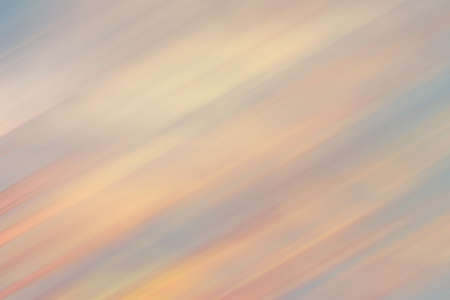Background with diagonal stripes. Soft pastel color and light. Red, orange, gray. blurred; defocused; design; light; abstract; wallpaperの写真素材