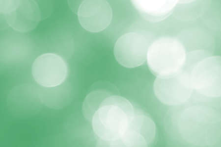 Defocused abstract background green lights. The theme of ecology, healthy lifestyle. Medicine, science, technology. Rod designer abstraction for writing of the text. Soft, light, abstract, bright, color.の写真素材