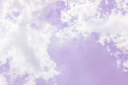 Fluffy white clouds on a pink background float in the sky. Dream. Femininity. Divine view. Background. Wallpaper. Concept pink glasses. affability, friendliness, amiability. copy spaceの写真素材