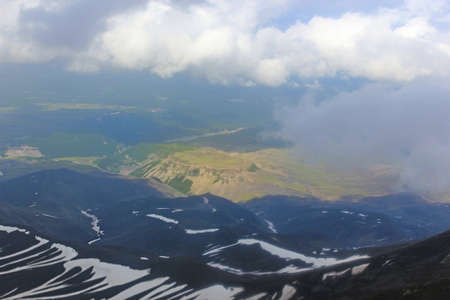 Edge of light, ends of the earth, above the clouds. The high point of the mountain. Vertex. A mystical place for climbers. Snowy peak.の写真素材