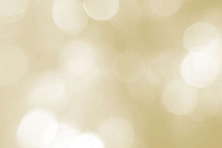 Beautiful sparkle, autumn and holiday background. Sunlight bokeh close-up. Yellow shine, background, texture. A subject for holidays, a birthday, a congratulation. A banner for advertizing.の写真素材
