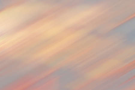 Background with diagonal stripes. Soft pastel color and light. Red, orange, gray. pattern; geometry; backdrop; fine; repeatingの写真素材