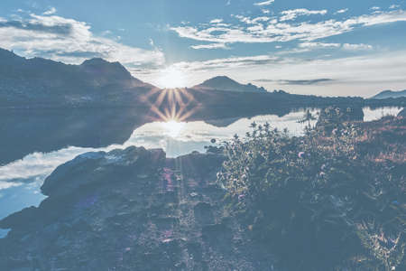 Scenic landscape outdoors. Sunset rays of the sun. Haze, mist, fog. communication, connection, film.の写真素材