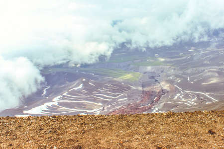 Edge of light, ends of the earth, above the clouds. The high point of the mountain. Vertex. A mystical place.の写真素材