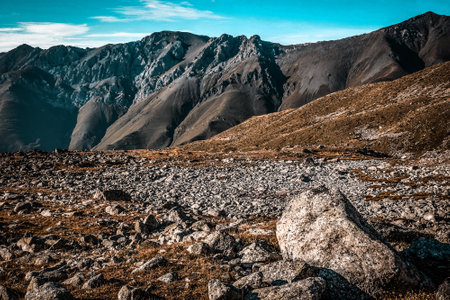 Picturesque mountain scenery with cumulus clouds. wildlife. Hiking. daytime. big stone close-up, autumnの写真素材
