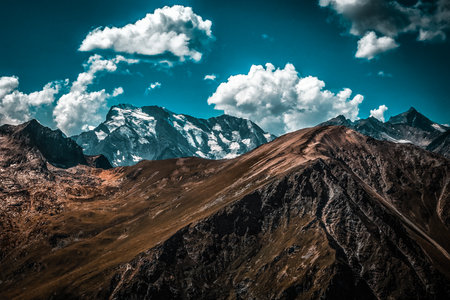 Picturesque mountain scenery with cumulus clouds. wildlife. Hiking. daytime. storm warningの写真素材