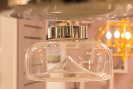 The ceiling glass chandelier is turned off in the interiorの写真素材