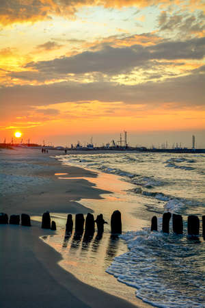 Sunset on the Batlic Sea - WÅadysÅawowo, in the background fishing boatsの写真素材