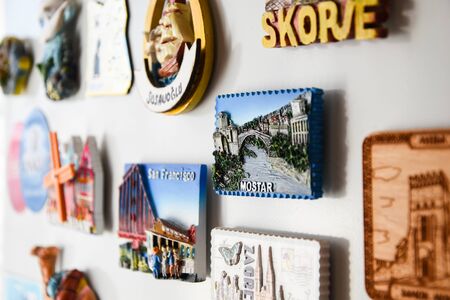Many magnets on the refrigerator from the countries of the world A new fridge magnet from the last vacation travel concept Mostar Bosnia, San Franciscoの写真素材