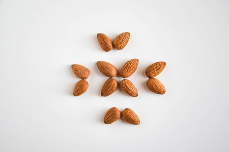almond nuts in the shape of flower flat lay, copy space, healthy food, nutritionの写真素材