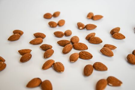 almond nuts in the shape of flower flat lay, copy space, healthy food, nutritionの写真素材