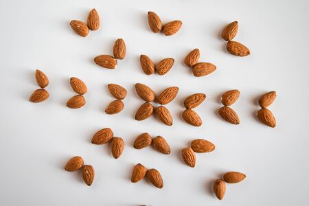 almond nuts in the shape of flower flat lay, copy space, healthy food, nutritionの写真素材