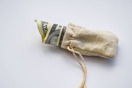 Money bag with dollars isolated on white background, business finance. save money for investment concept money bag, copy spaceの写真素材